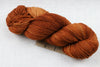 six and seven fiber alfalfa fingering merino cashmere nylon rust